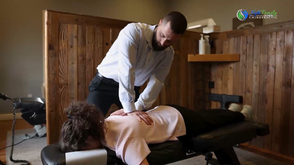 Dr. Langley performing a chiropractic adjustment